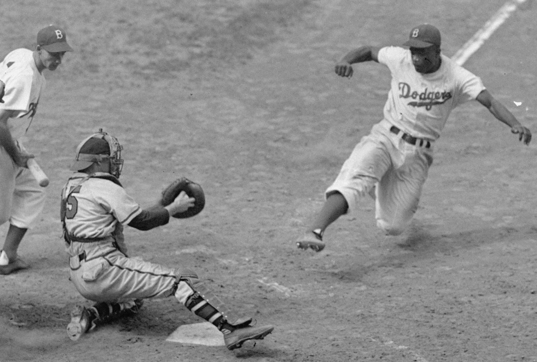 Robinson slides into home